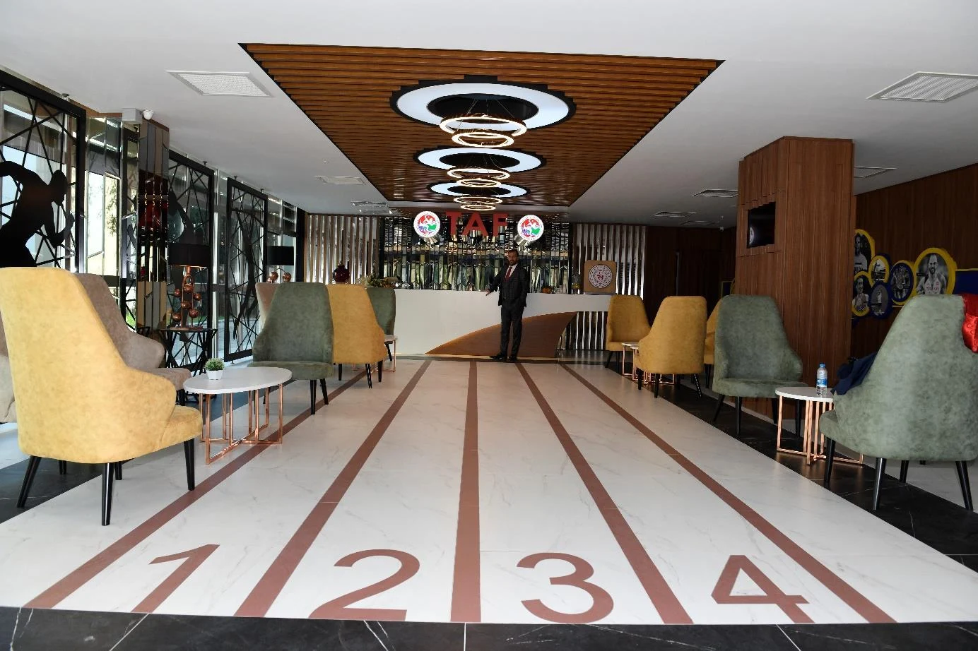 Track-inspired reception lobby at the TAF / Turkcell Athletics High Performance Center