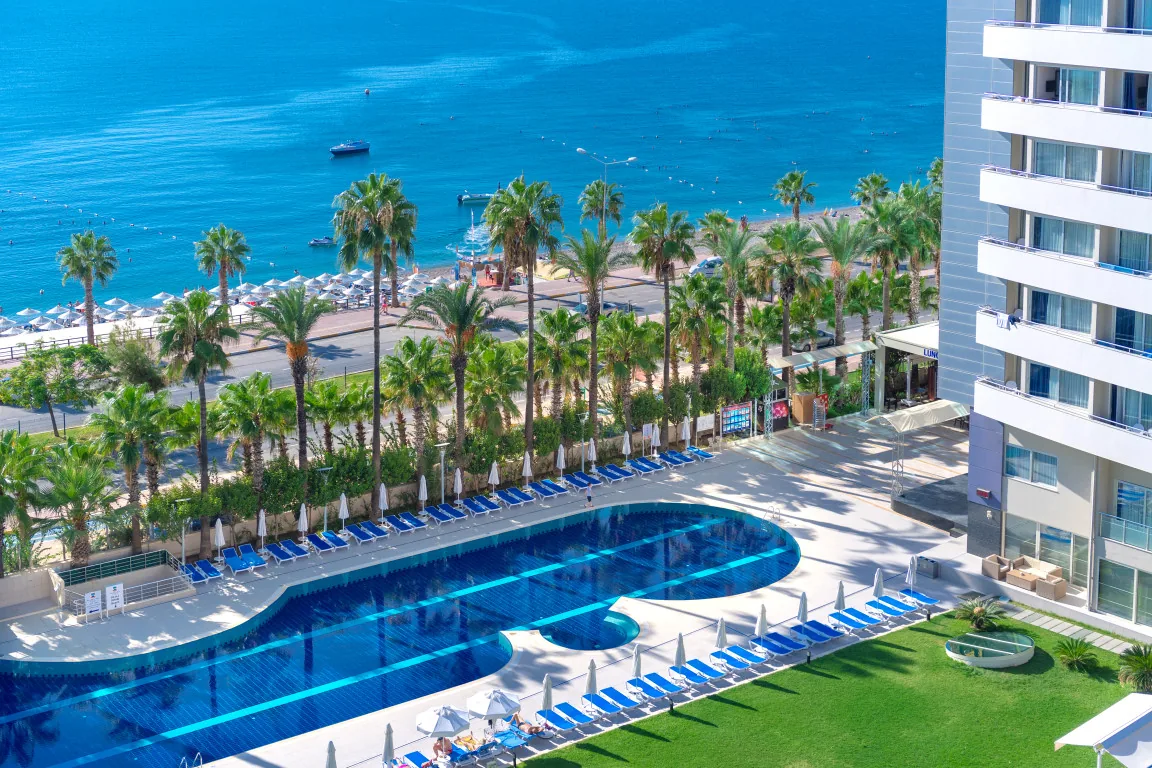 Outdoor pool and sea view at Porto Bello